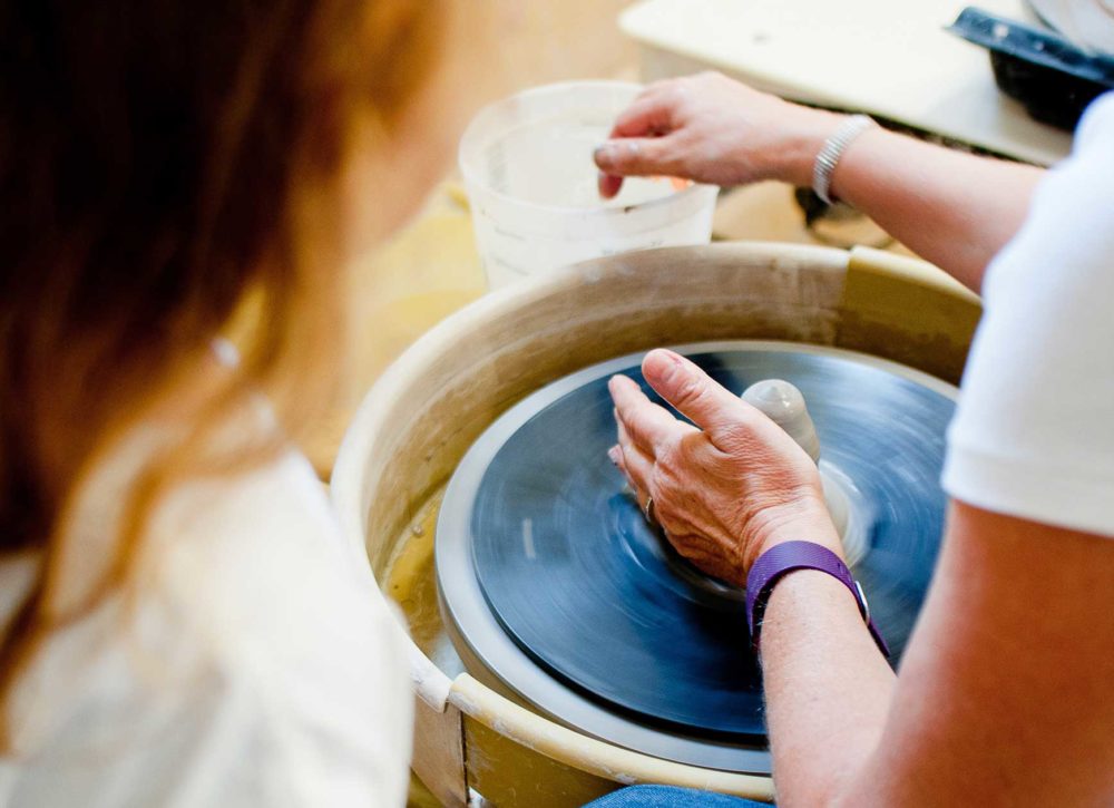 potter using a pottery wheel